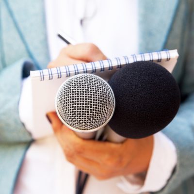 Reporter with Microphone